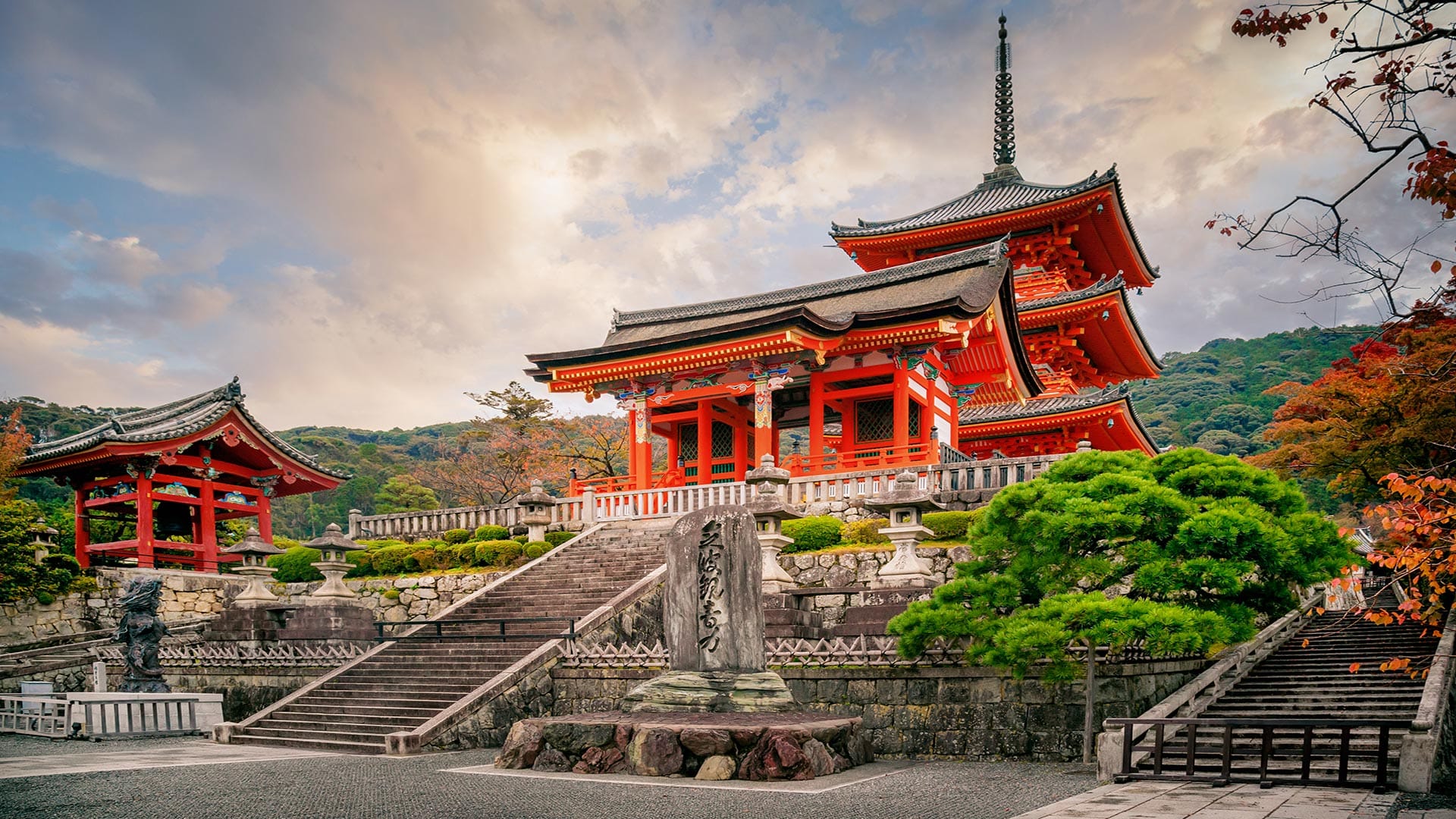 Kiyomizu-dera Temple in Kyoto surrounded by vibrant greenery and autumn colors