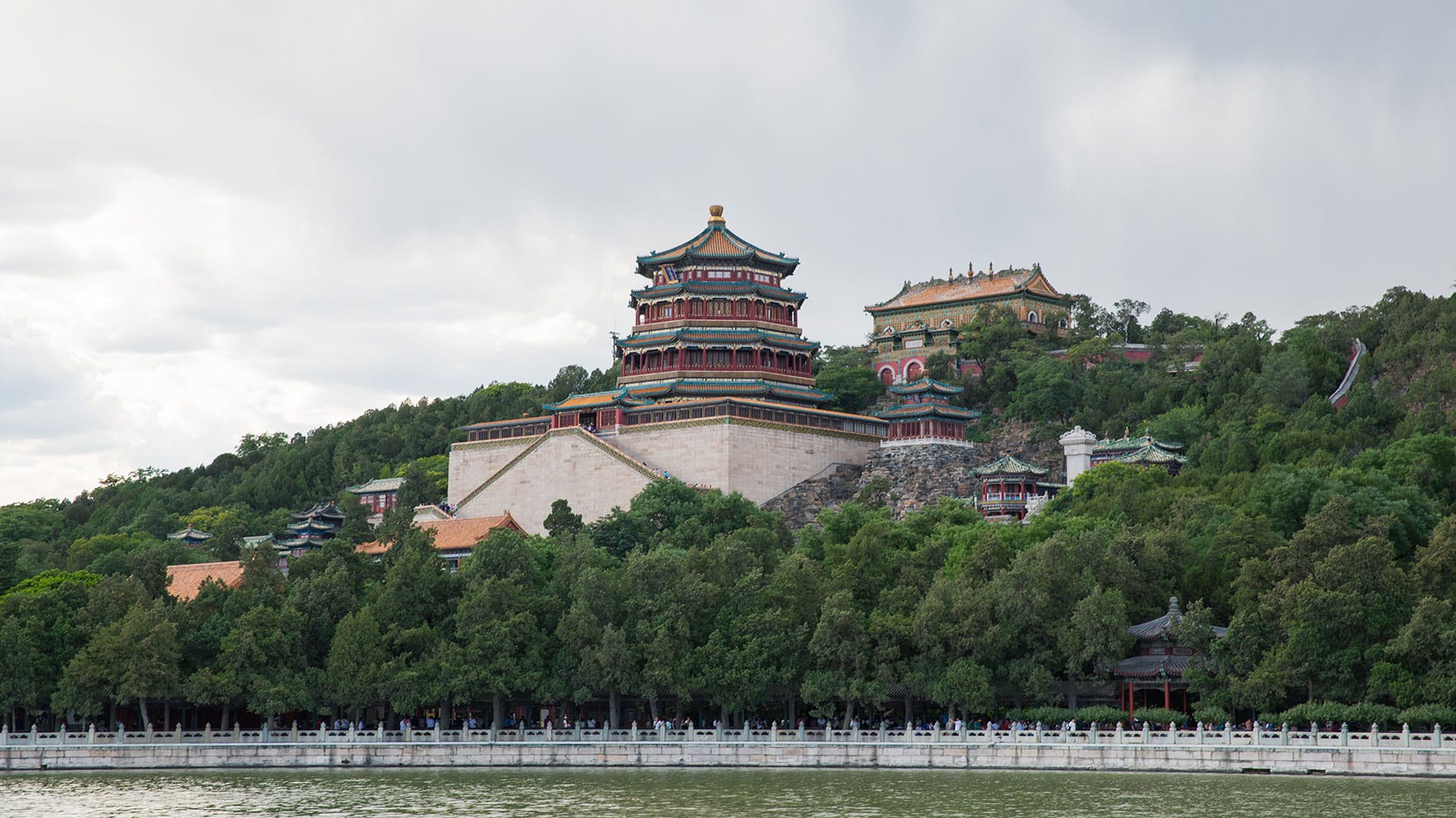 The majestic Summer Palace in Beijing, surrounded by lush greenery and overlooking the calm waters of Kunming Lake