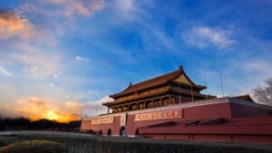 The majestic Tiananmen Gate in Beijing, China, illuminated by the golden hues of a sunset.